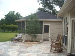 screened porch with stamped concrete