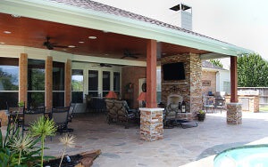 Cypress patio cover with fireplace and kitchen