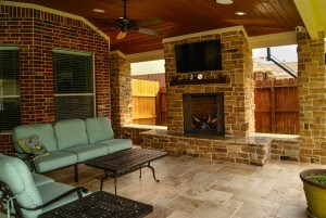 Outdoor fireplace at the end of the patio cover