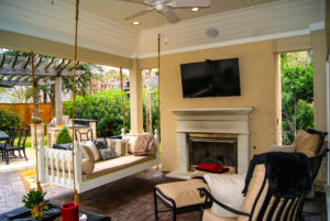 Vaulted ceiling and porch swing in outdoor living space