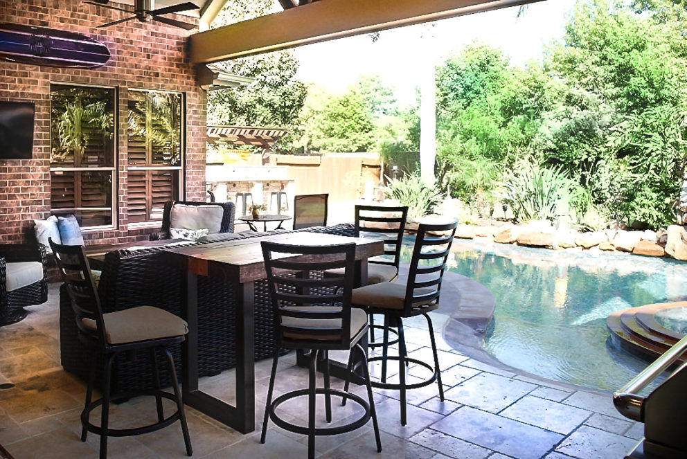 Outdoor living area attached to pool