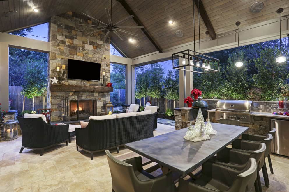 Outdoor fireplace as central focus in patio cover Houston