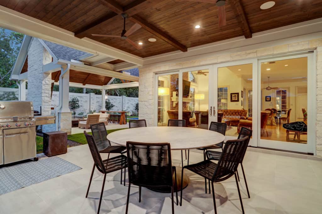 Outdoor eating area with big patio french doors