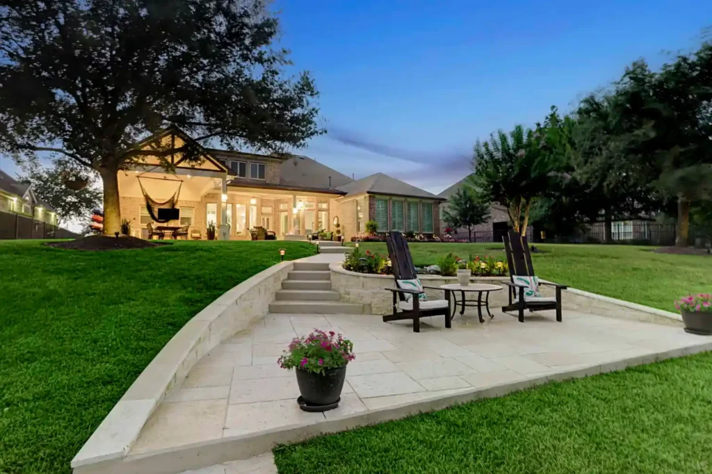 Outdoor Living with summer kitchen, firepit and open air patio by the water in Cypress TX